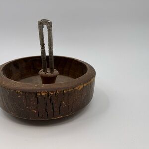 Vintage nutcracker set. Brown wooden bowl.